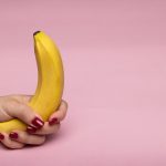A Person Holding Yellow Banana Fruit