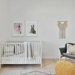 a bedroom with a bed and a chair in a room