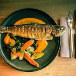 fish dish on blue ceramic plate
