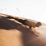 man sliding on deserted place going down
