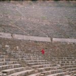 woman sitting on grand stand