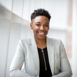 Woman Wearing Gray Notch Lapel Suit Jacket