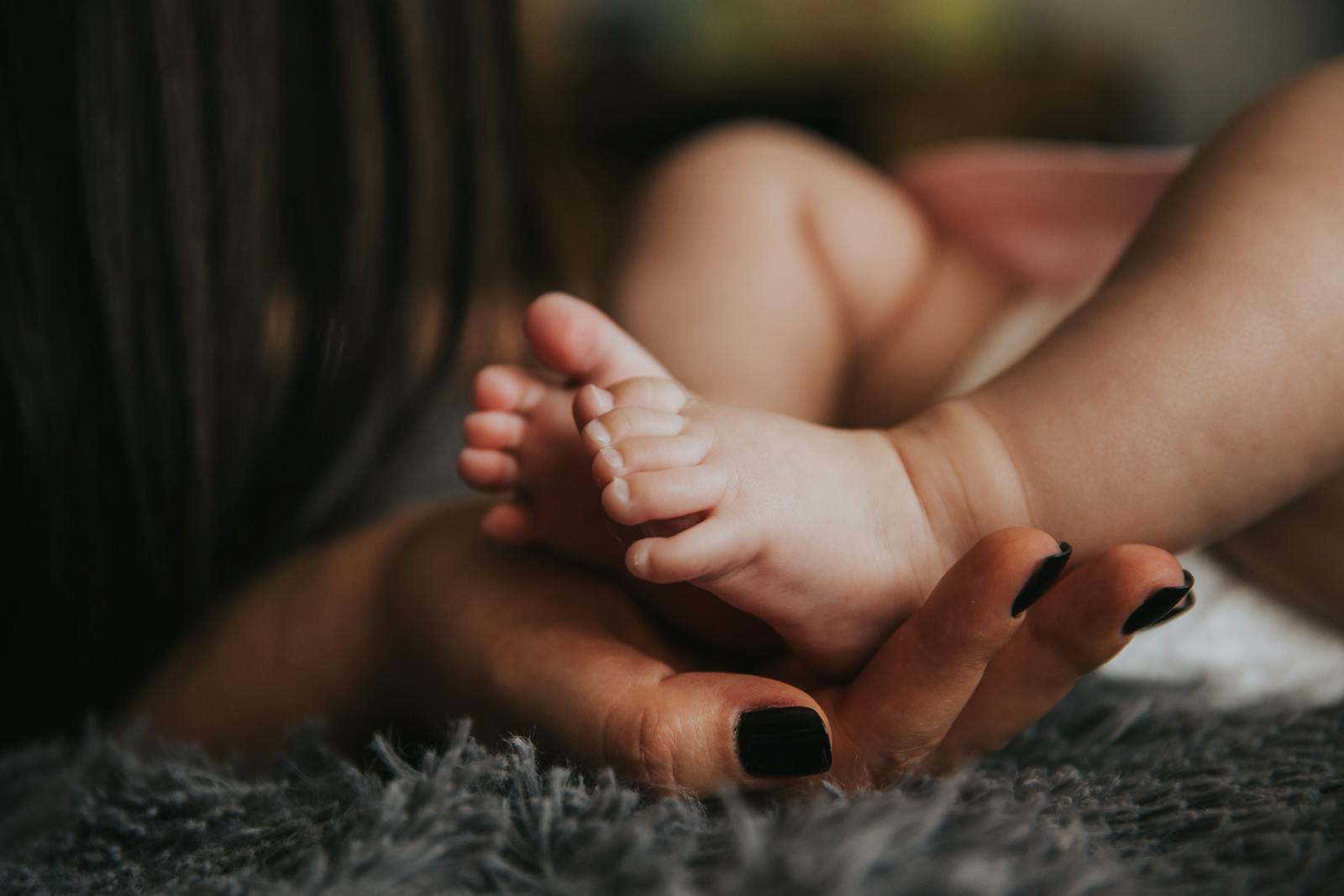 Everything Parents Need to Know About Sudden Infant Death Syndrome (SIDS) and How to Prevent It 1 Person Holding Baby's Feet in Selective Focus Photography