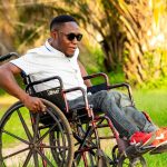 man on a wheelchair, wheelchair, push