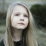close-up photography of girl in black top during daytime