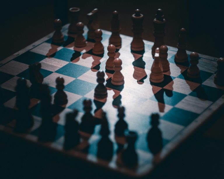 a chess board with a lot of chess pieces on it