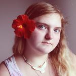 a woman with a flower in her hair