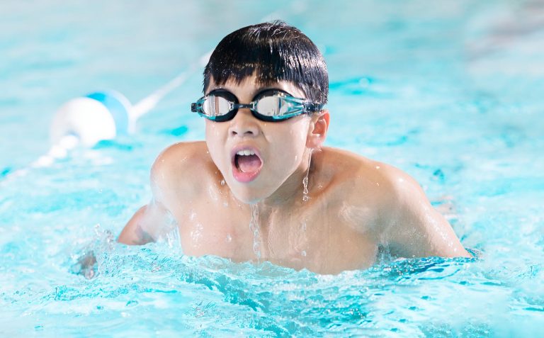 A Boy Swimming in the Pool