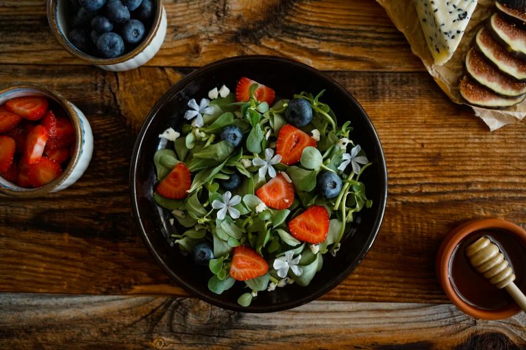 Organic Salad with Strawberries, Blueberries, Herbs and Edible Flowers