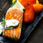 Grilled Salmon Fish on Top of Grilled Vegetables