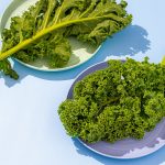 a couple of plates of broccoli on a table